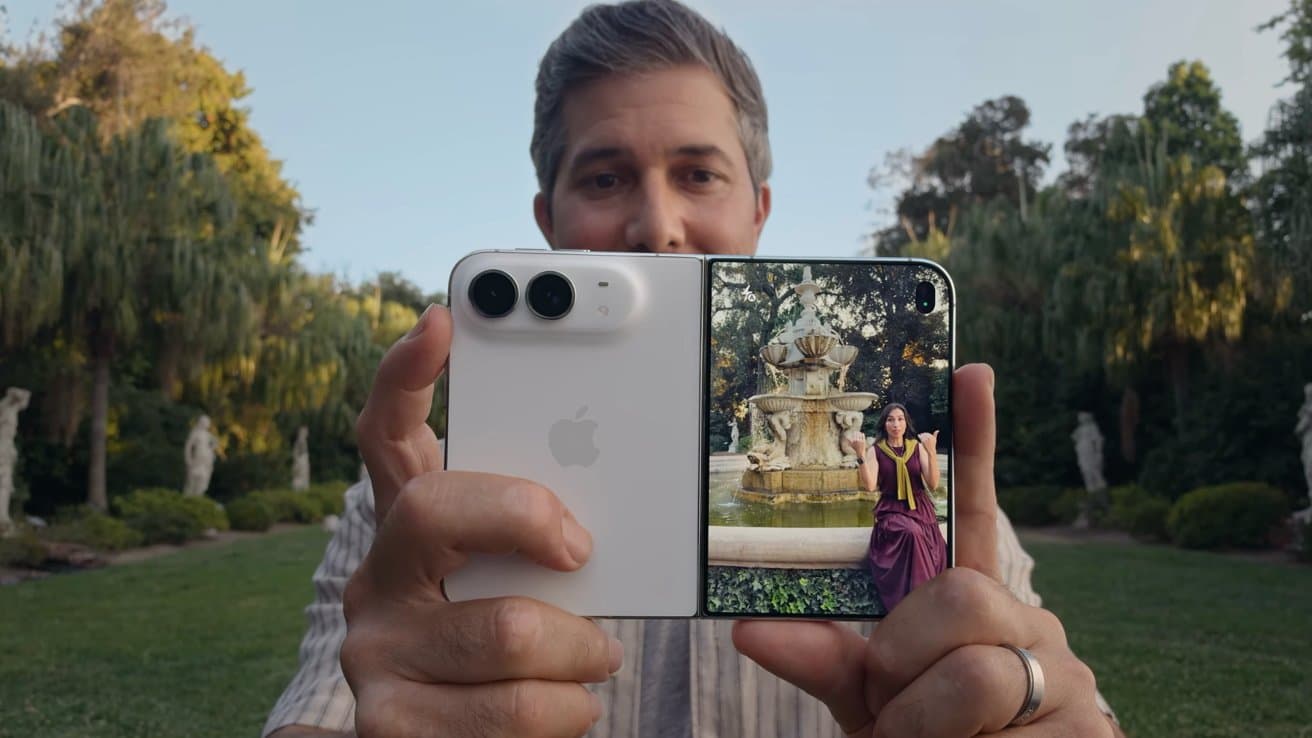 No, you won't be able to play two videos at once on iPhone Duo